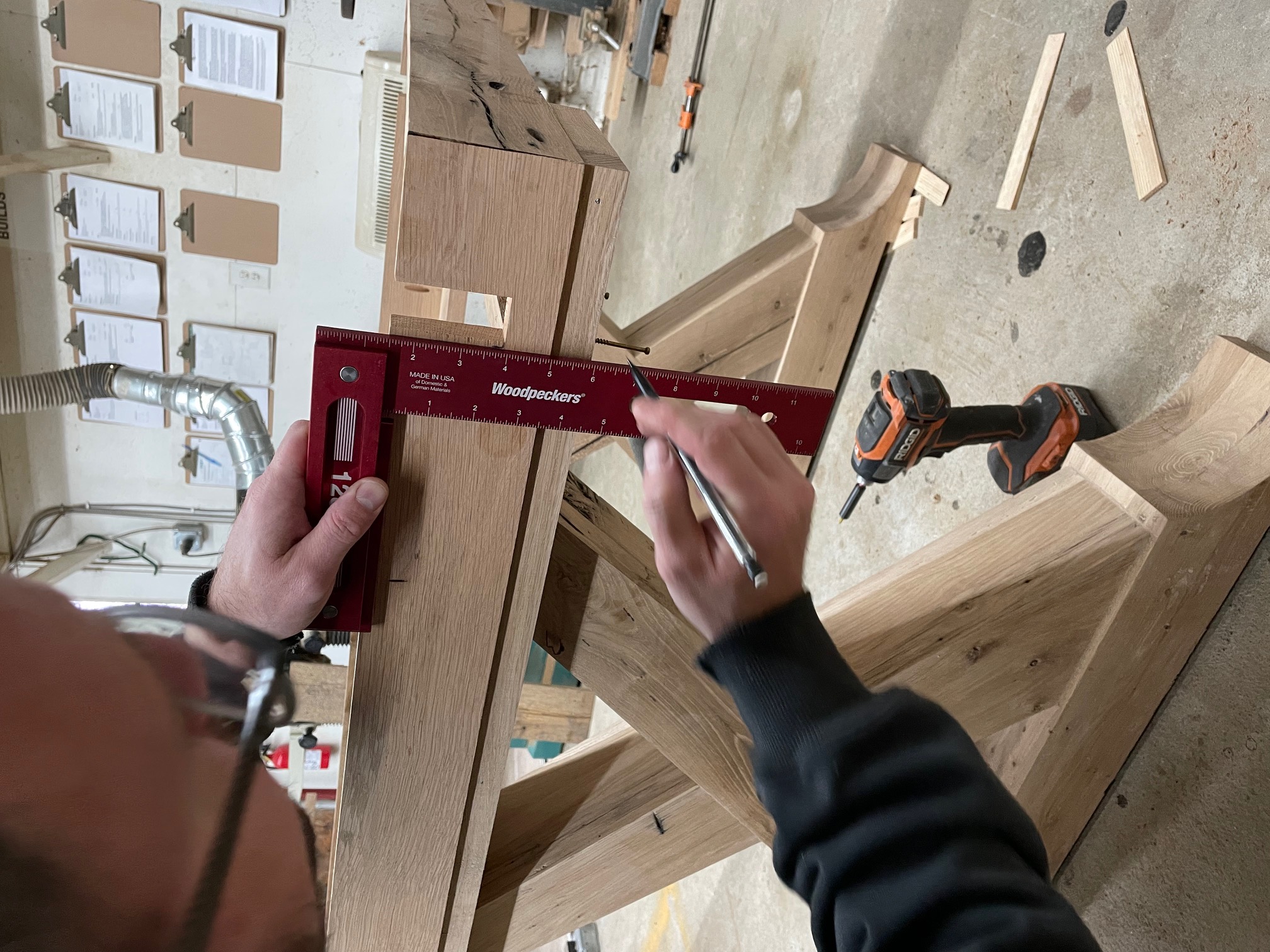 Marking a real cut line with a square, right at the bench